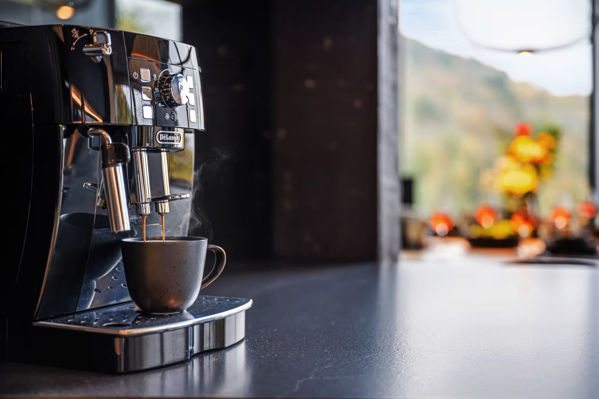 Holiday-home photographer — coffee machine with steaming coffee