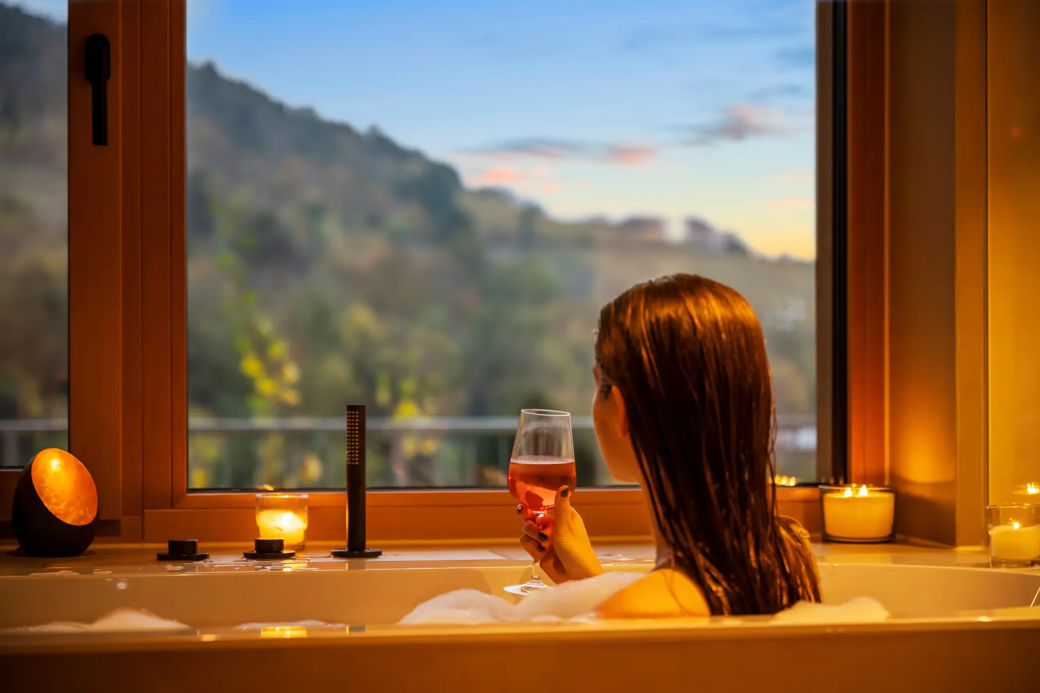 Holiday-home photographer — a person taking a bath, showing the view