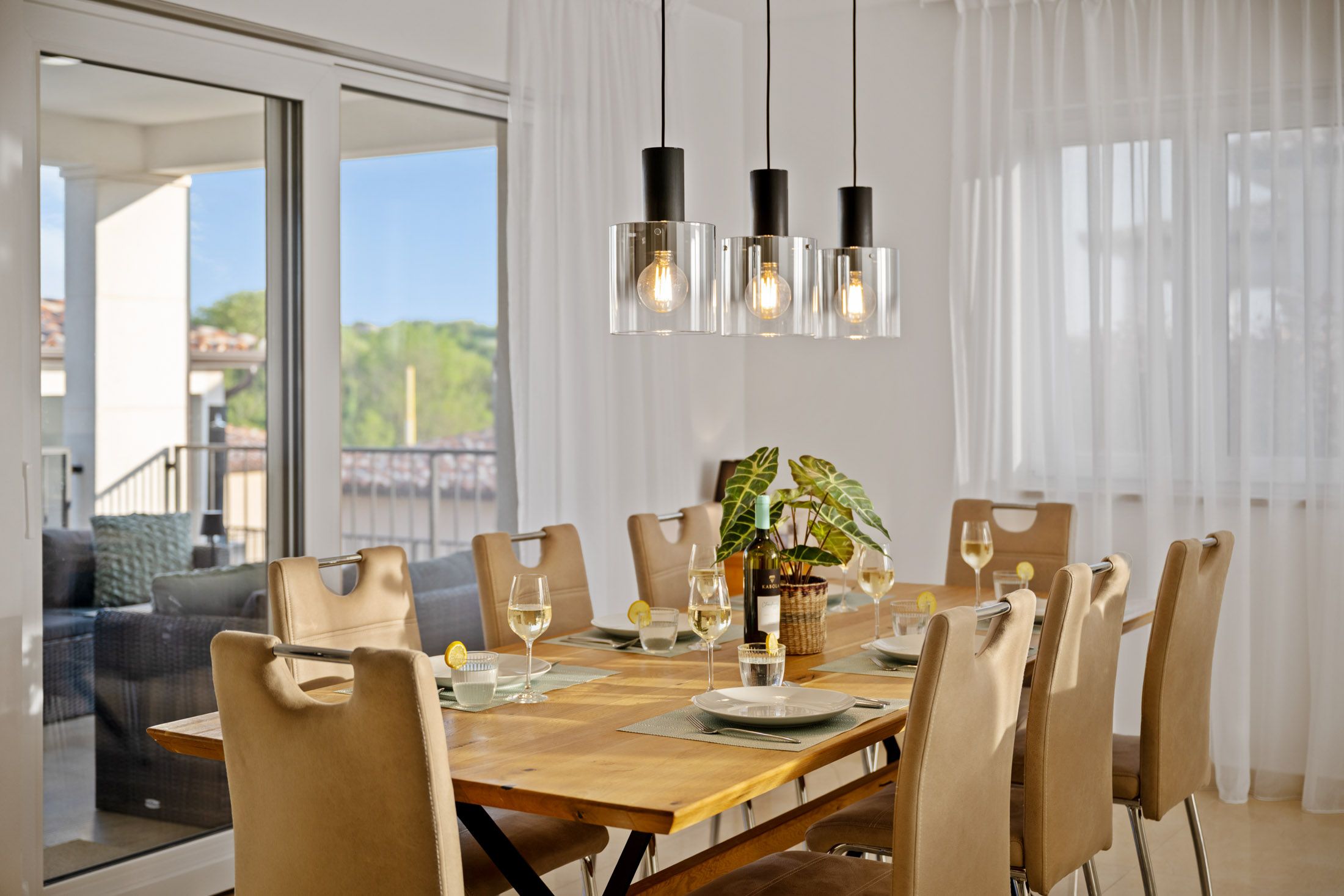 Set dining table in the evening under pendant lights