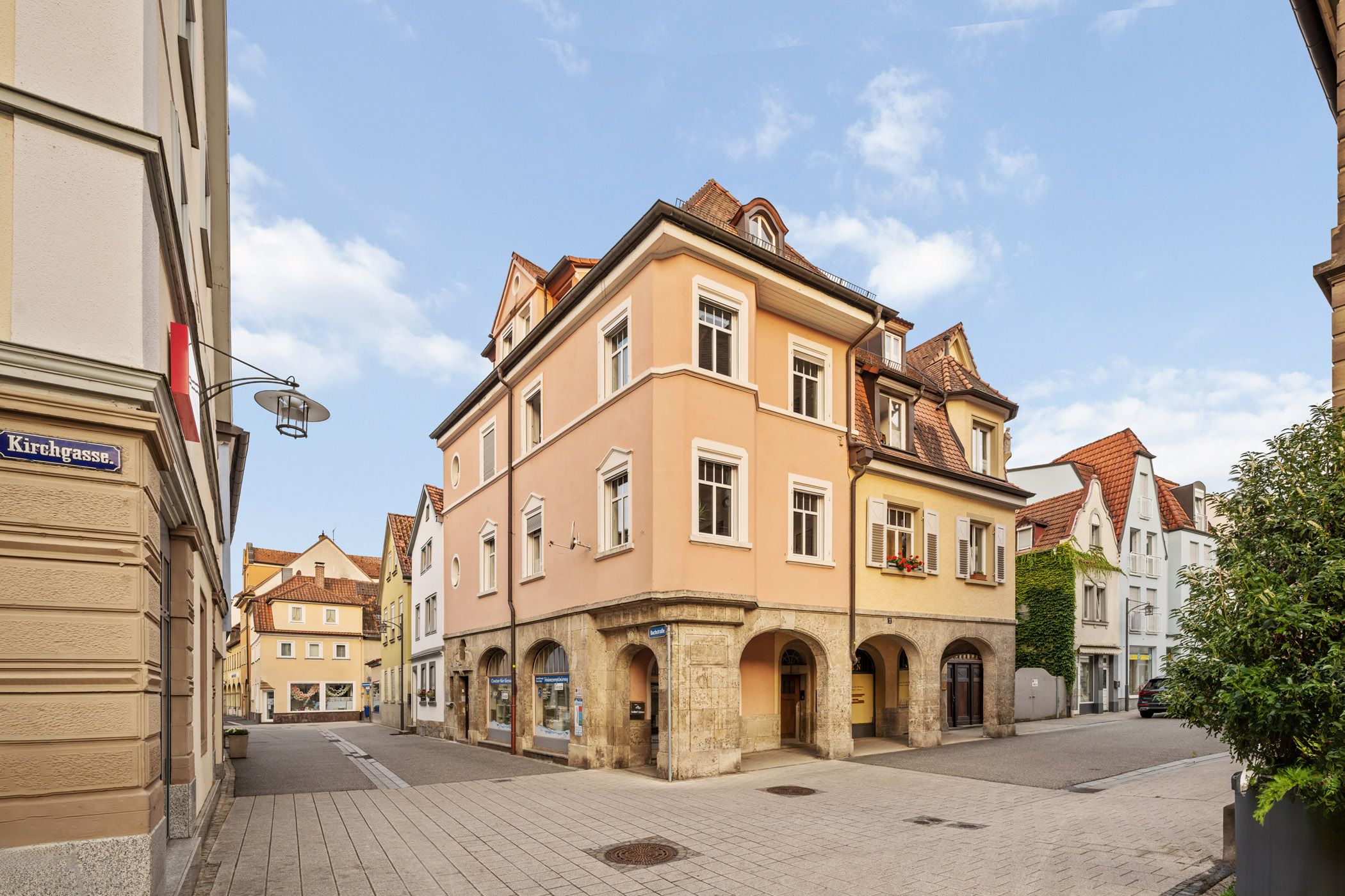 Historic corner building with a view into the old town alley