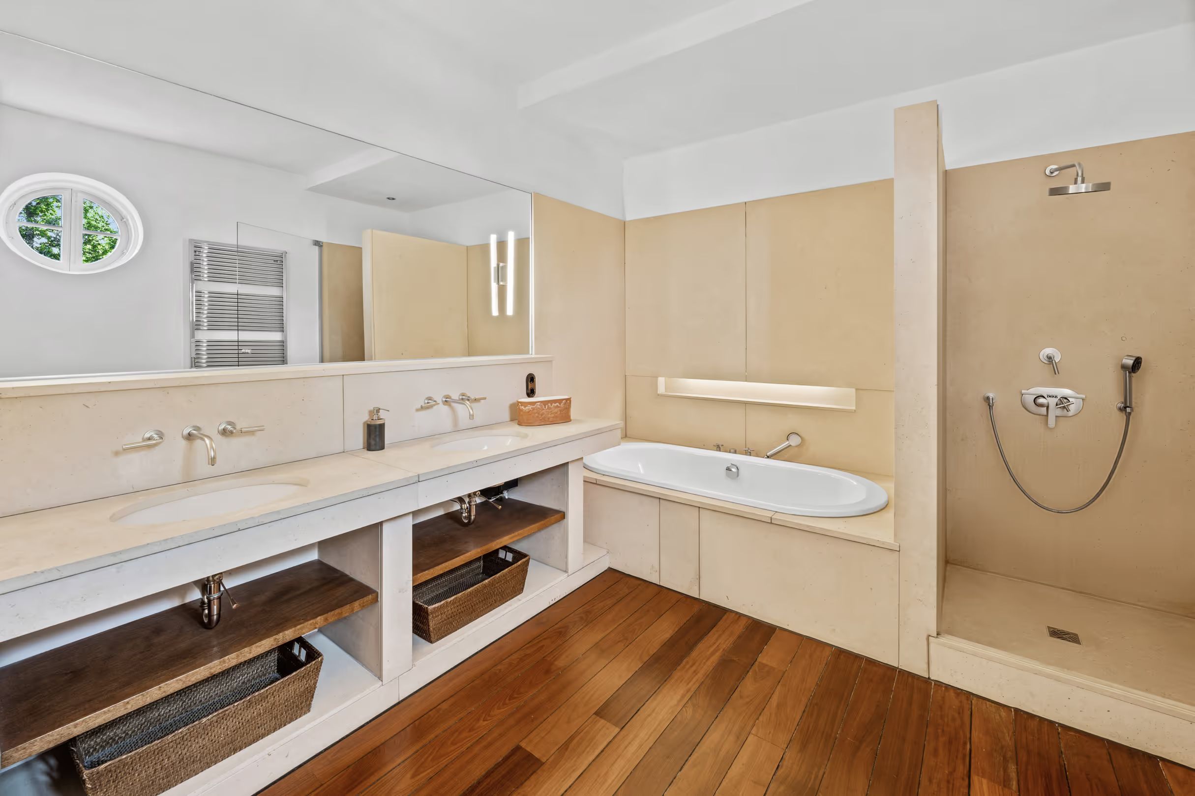 Bathroom with a double vanity, tub and shower