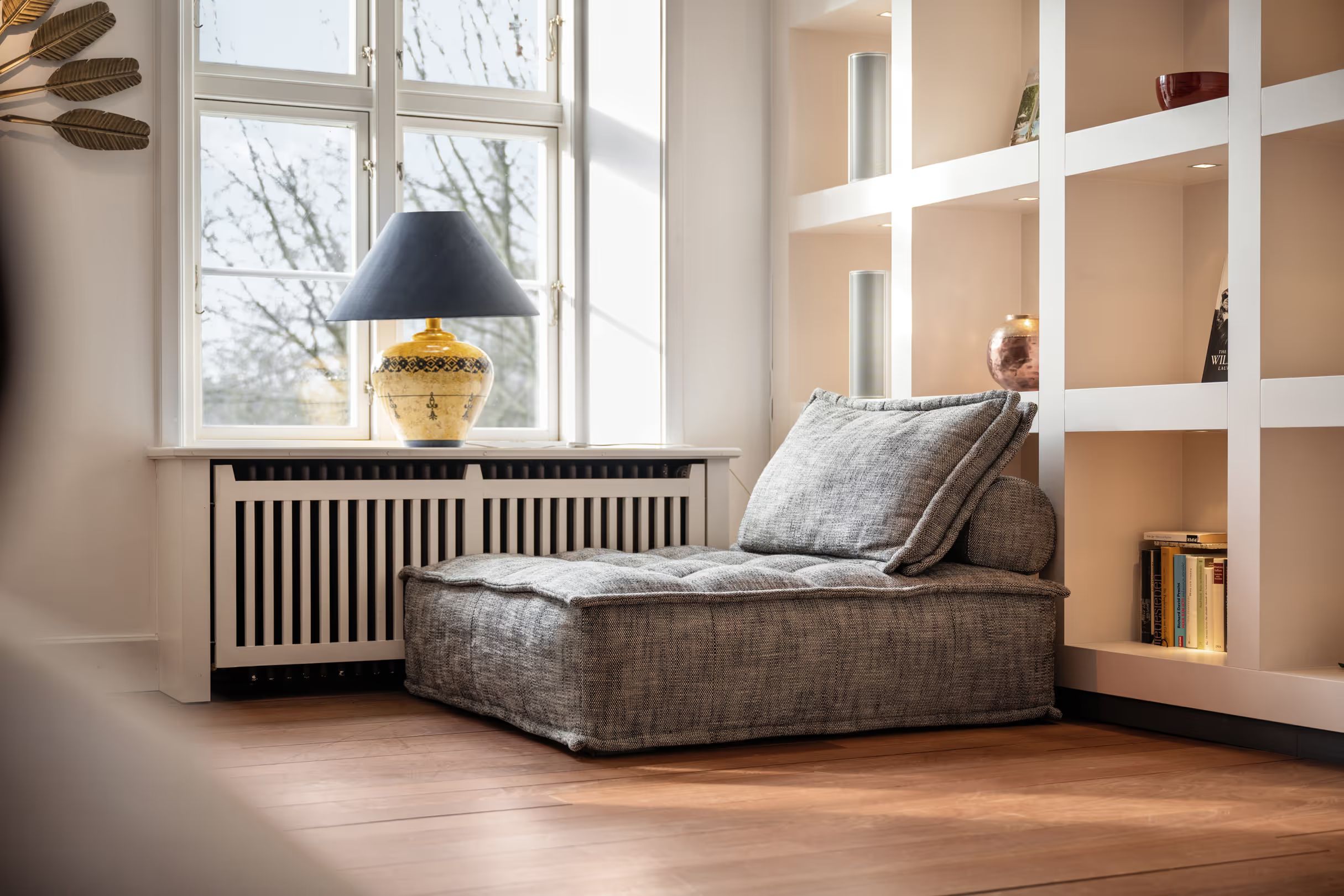 Seating nook by the window with a bookshelf