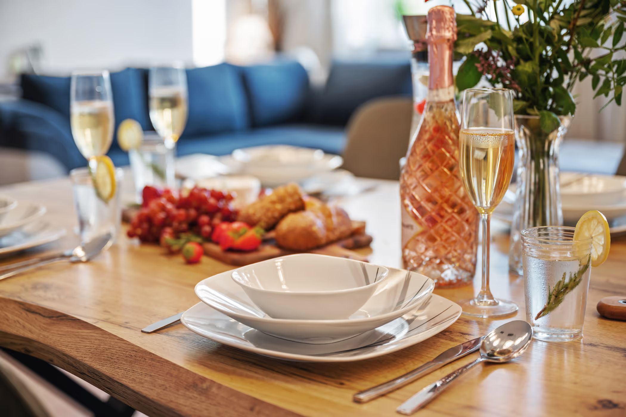 Set table with sparkling wine and a light breakfast