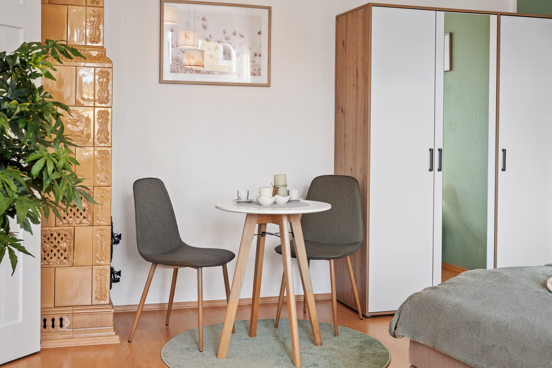Seating nook with tiled stove and round table