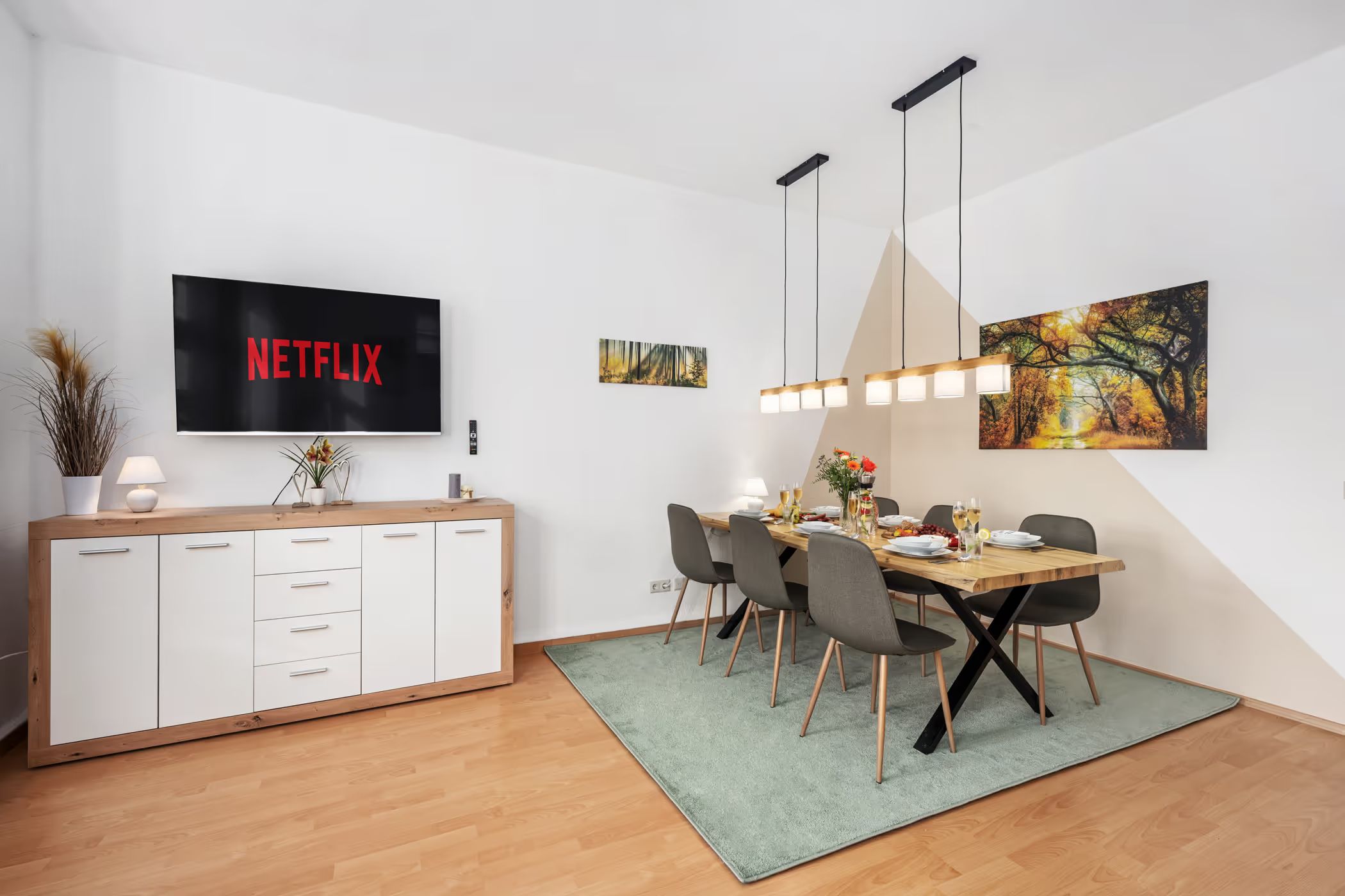 Dining area with sideboard and television