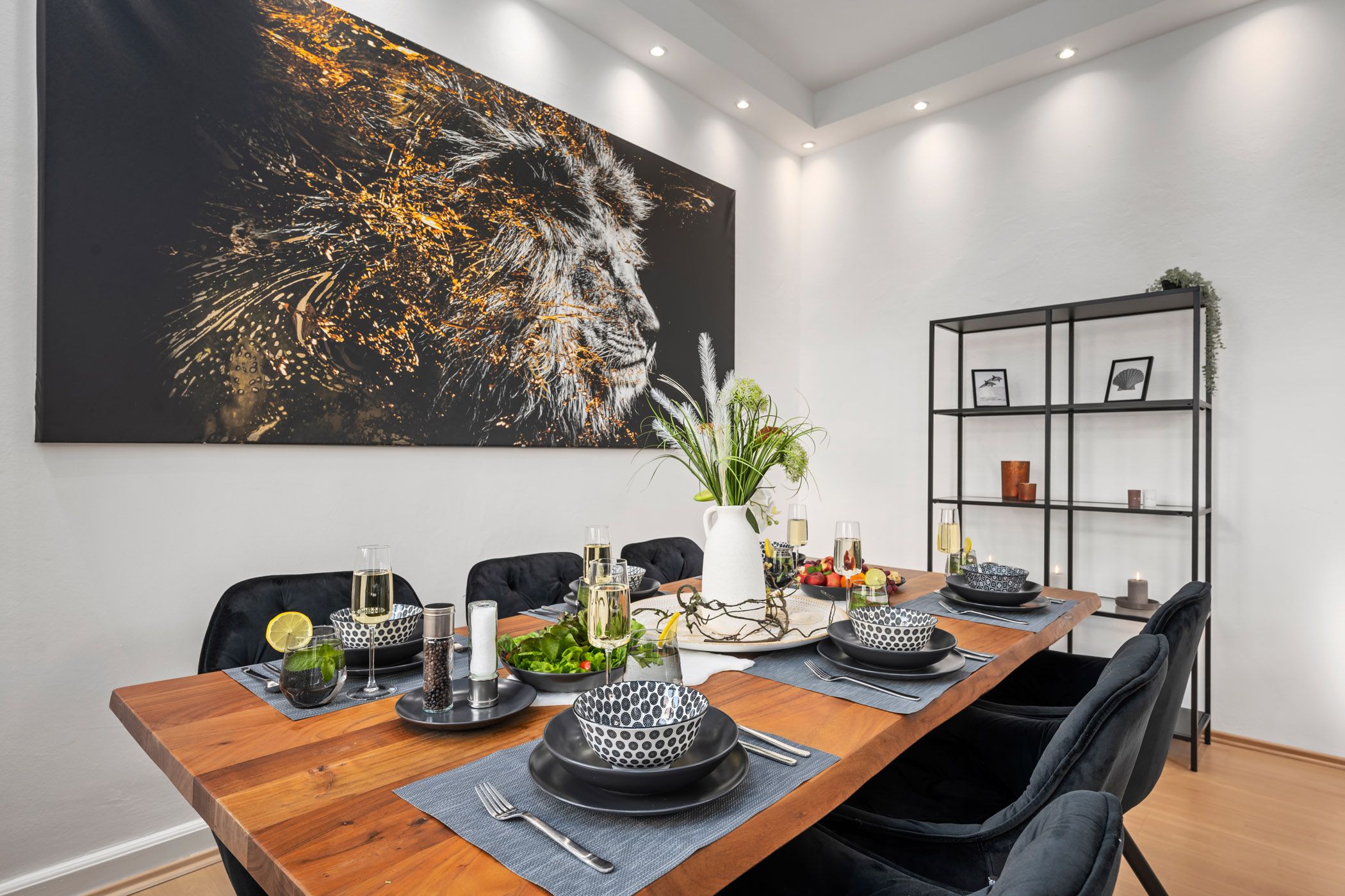 Dining room with a set table and lion picture