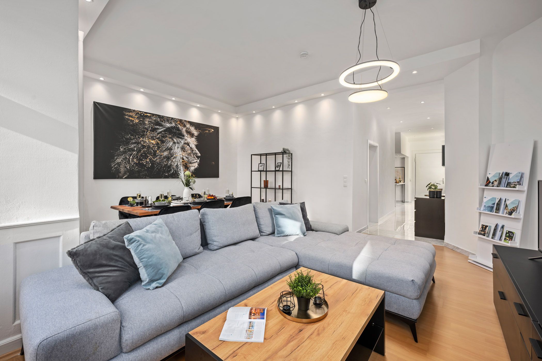 Living area with a sofa and lion motif on the wall