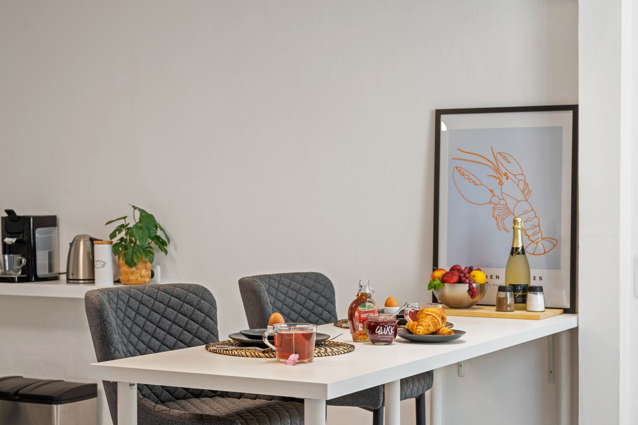 Set breakfast table with a croissant and jam