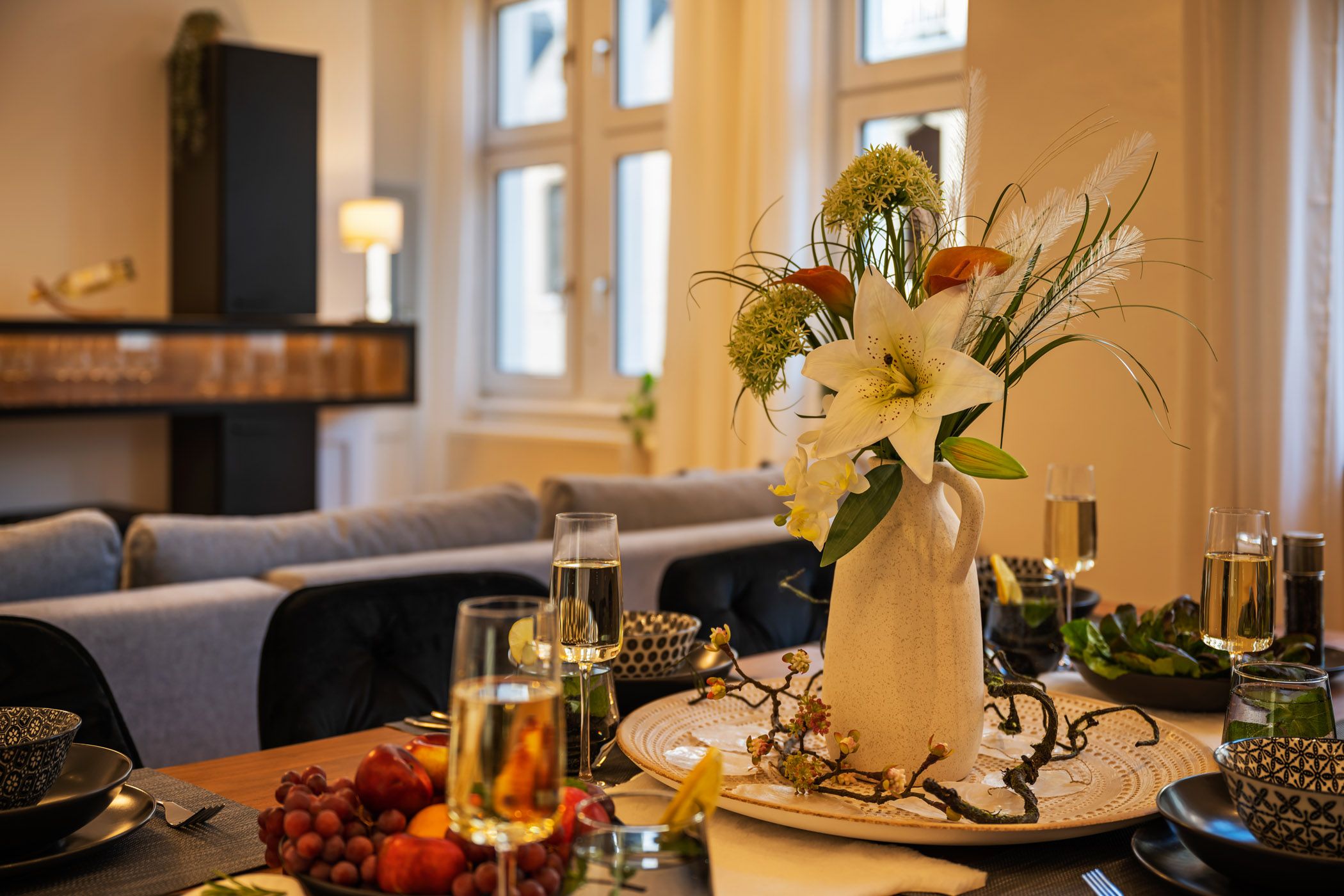 Set dining table with a bouquet of flowers and champagne glasses