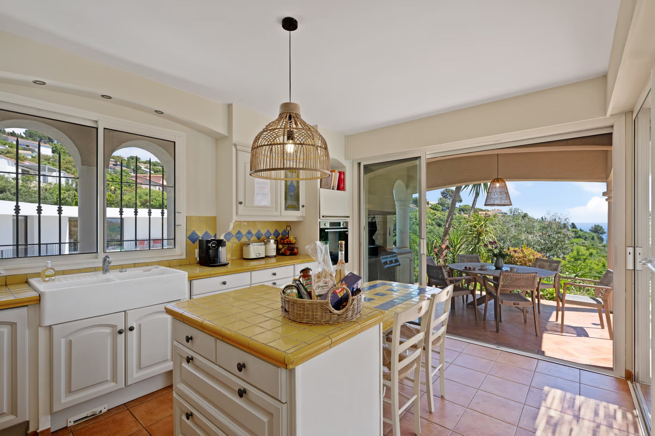 Country-house kitchen with a view onto the terrace