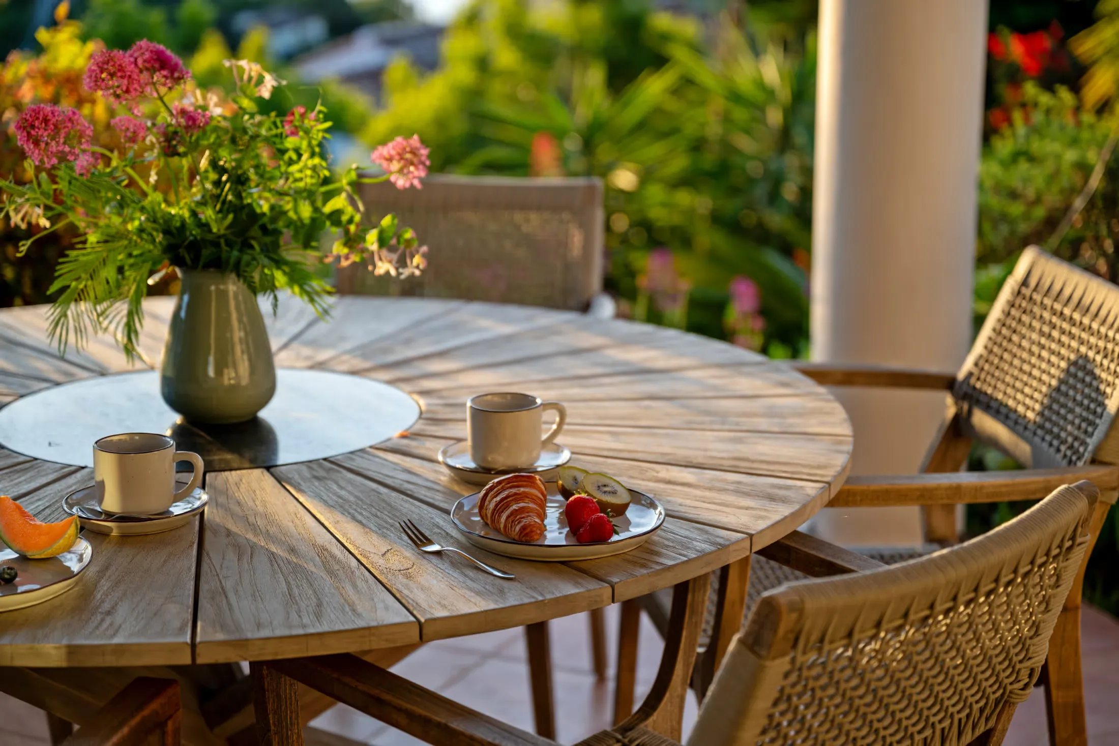 Set breakfast table with coffee and flowers