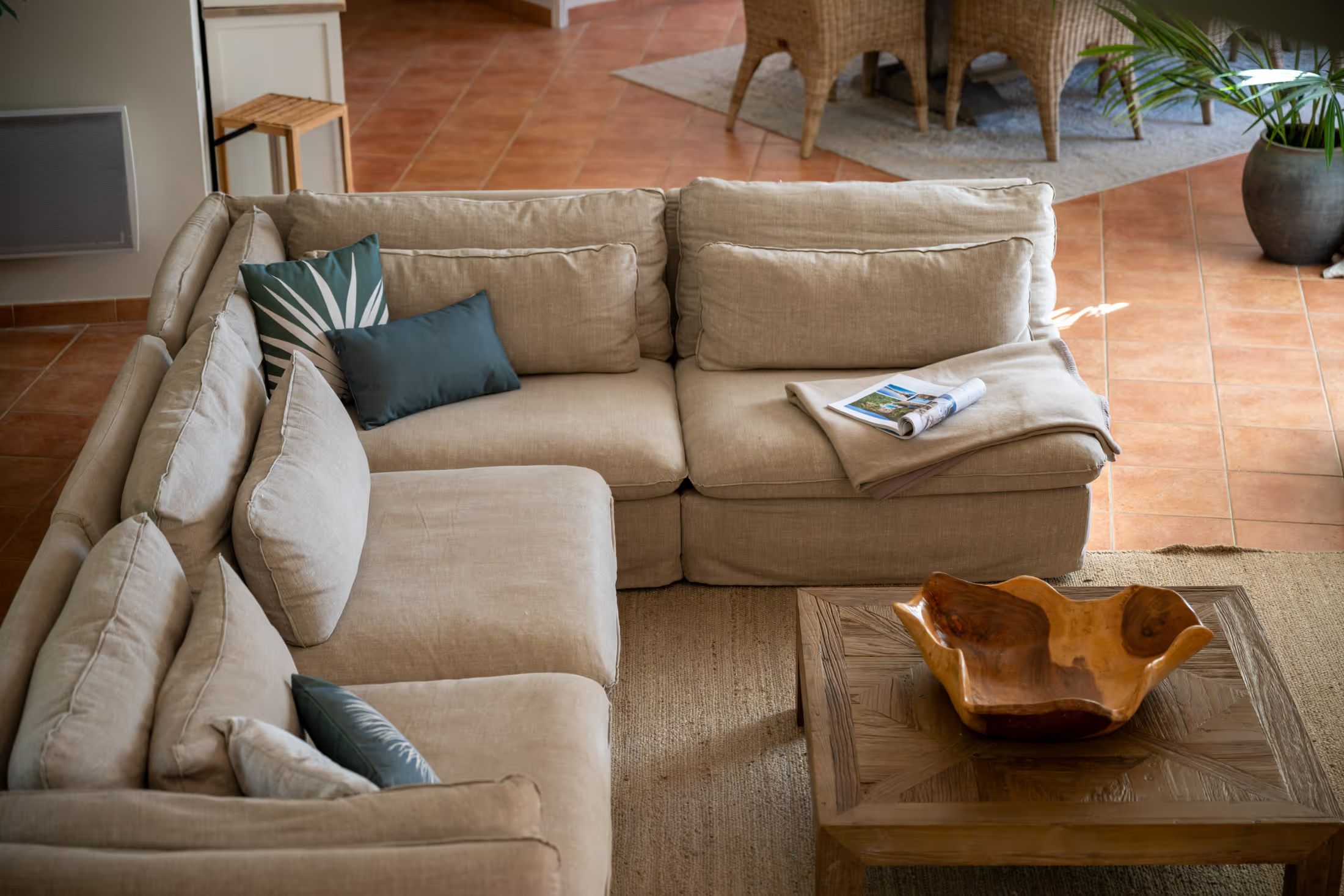 Corner sofa with cushions in the living area