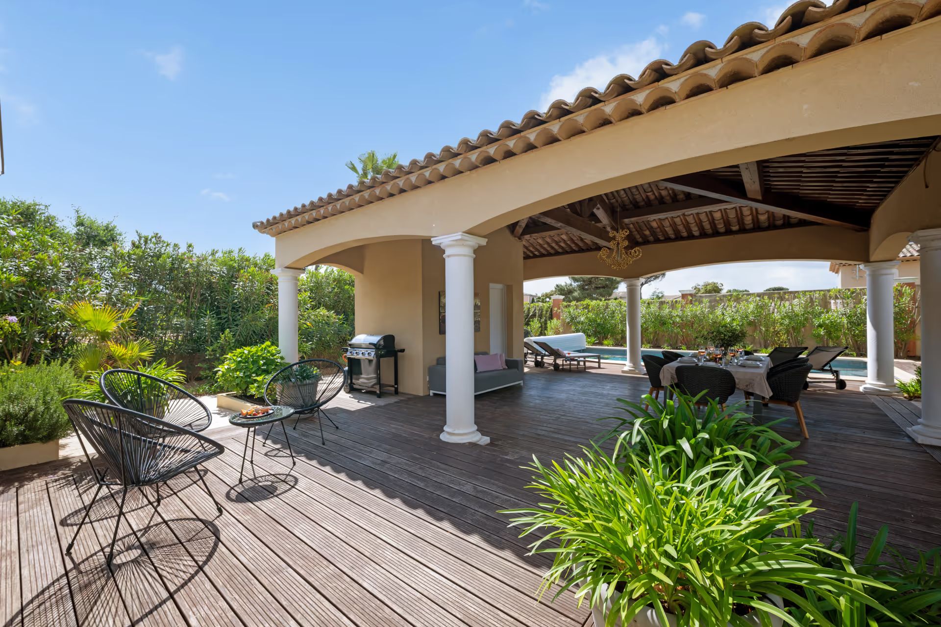 Pool terrace with a covered dining area