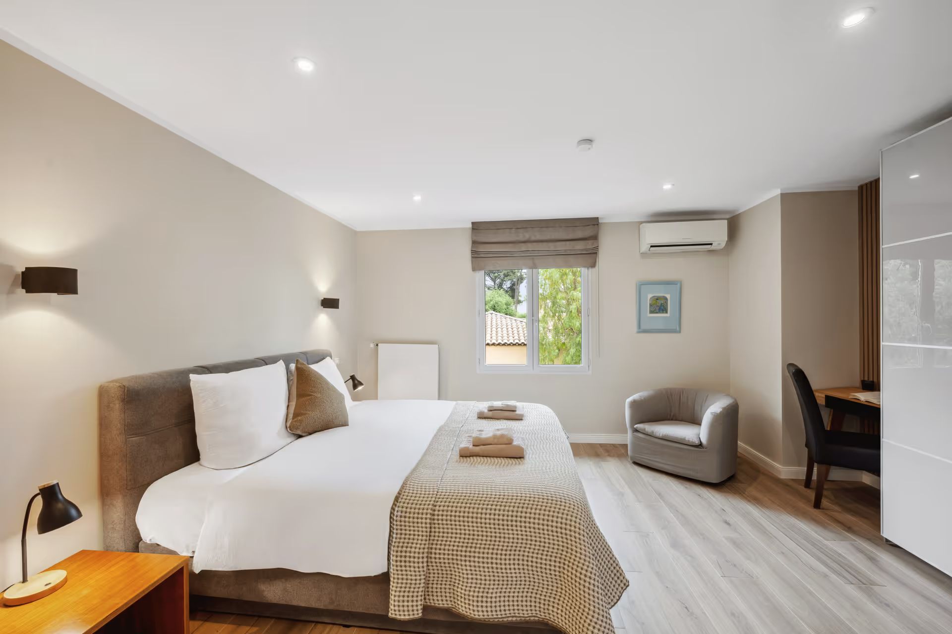 Bedroom with a double bed and seating area