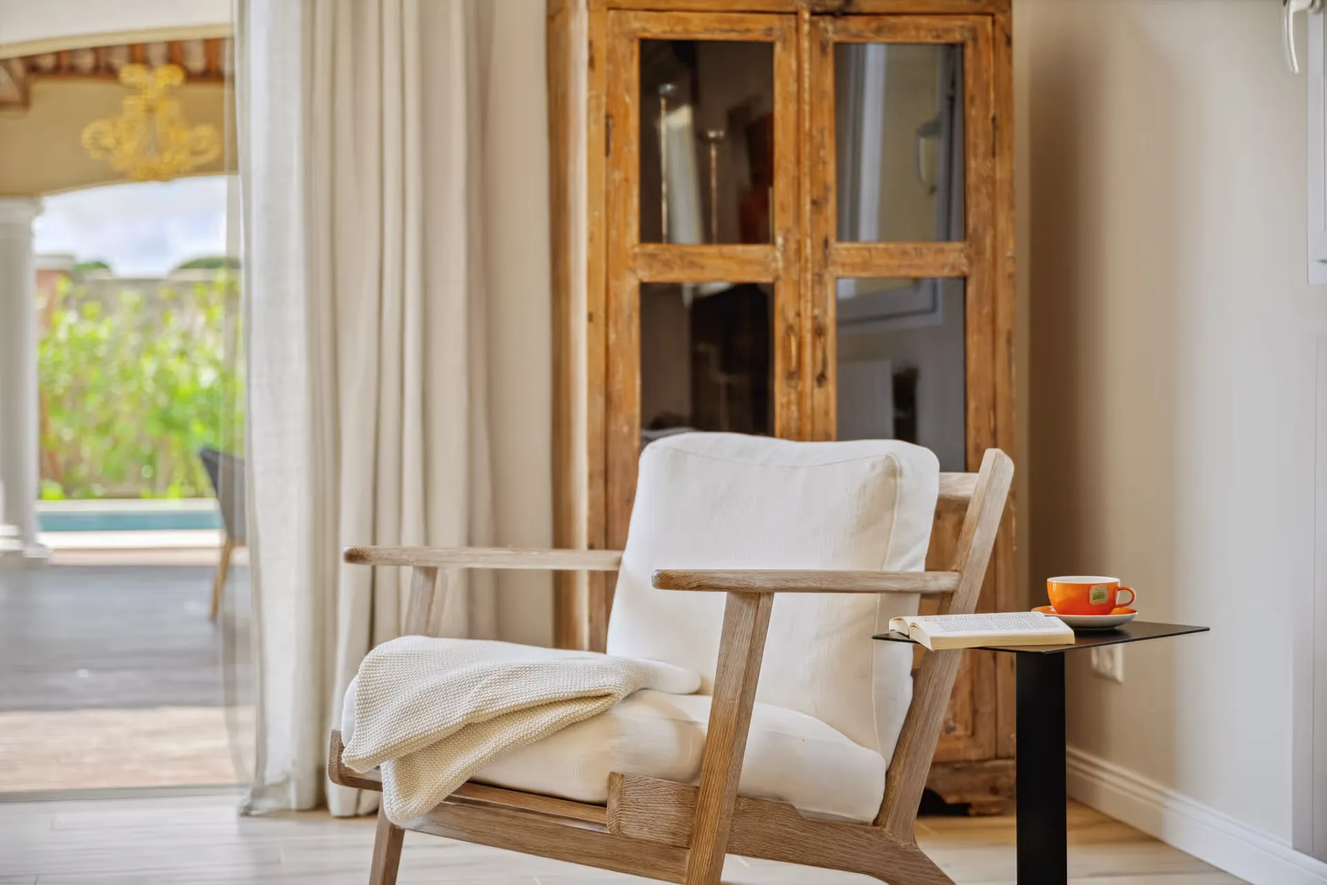 Armchair and display cabinet in a cozy reading nook