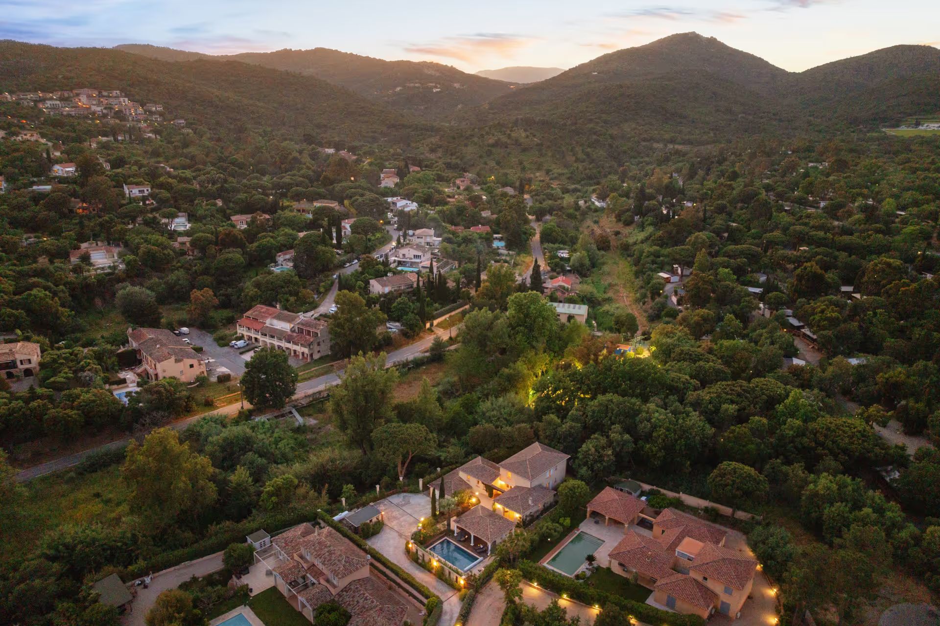 Aerial view of the property at dusk